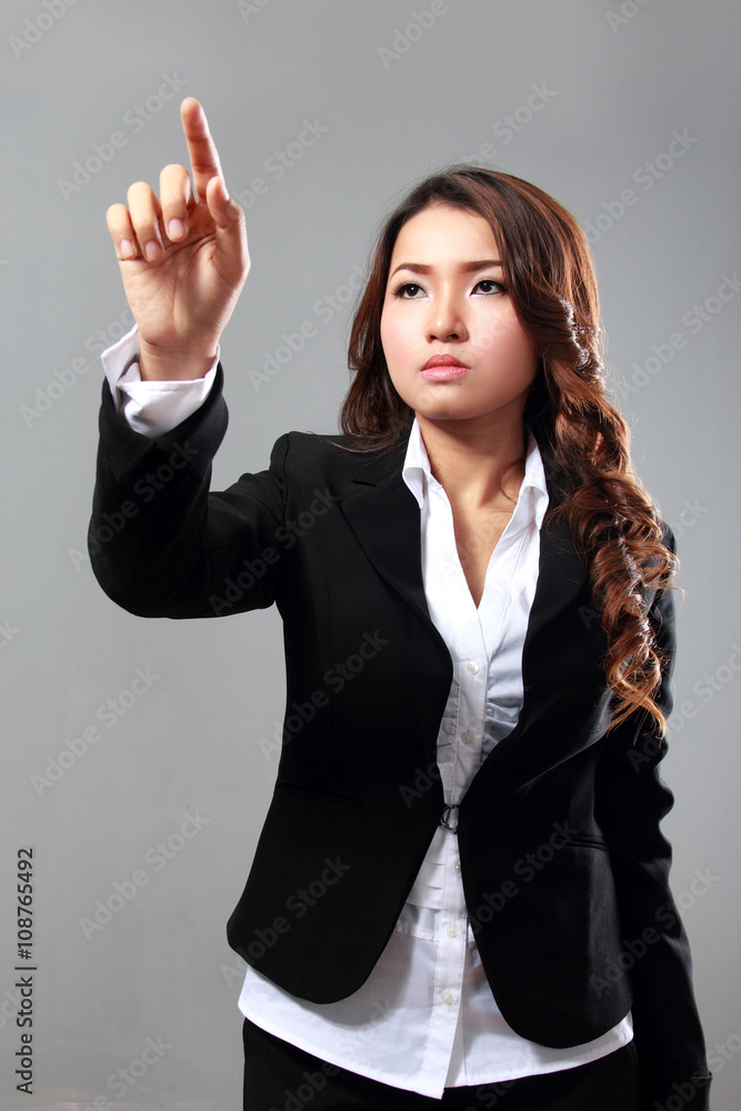 Businesswoman touching virtual screen Businesswoman touching virtual screen