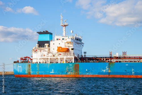 The quarterdeck of a cargo ship at sea.