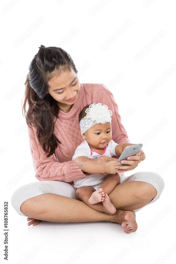 Woman with her baby using tablet together