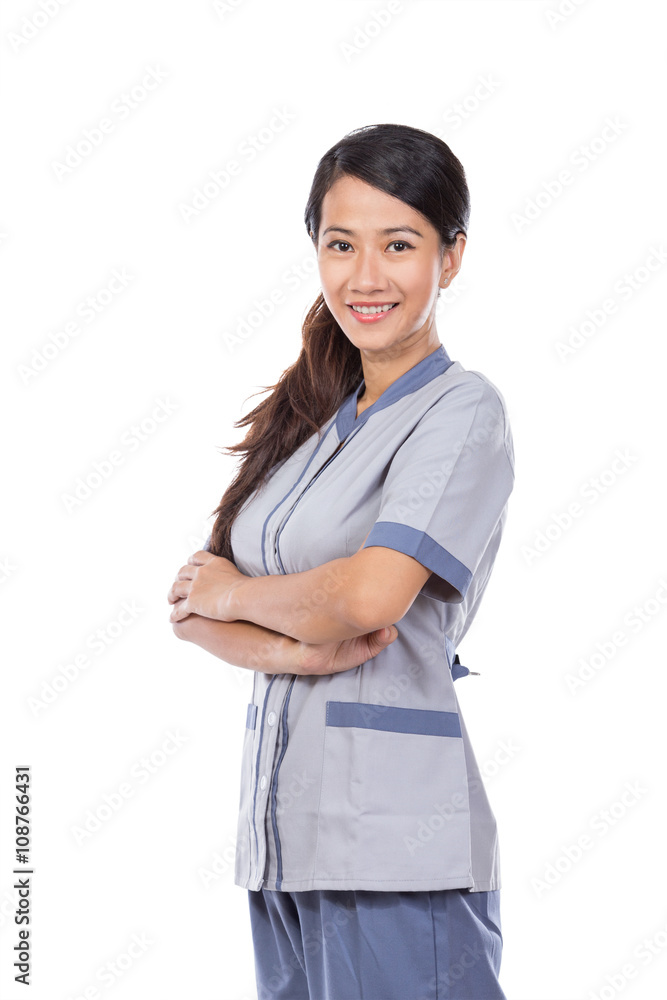 Beautiful Asian maid in uniform crossed arm Beautiful Asian maid in uniform crossed arm