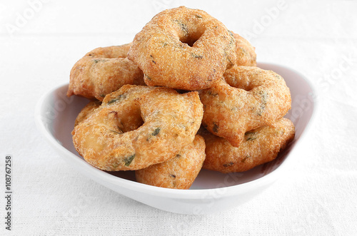 Indian food medu vada, also known as urad vada, a traditional and popular dish. photo