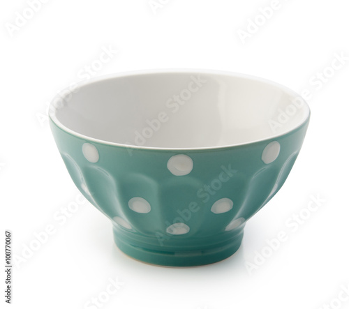 Blue bowl with white polka dots. Isolated with clipping path.