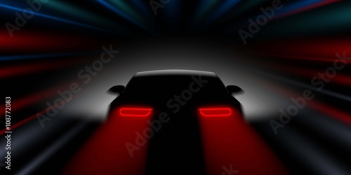 car quickly rushes in the dark rear view