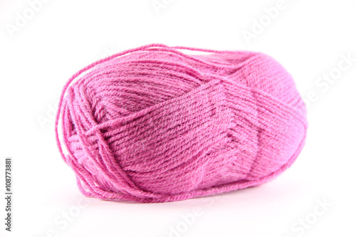 Oval ball of pink yarn white background