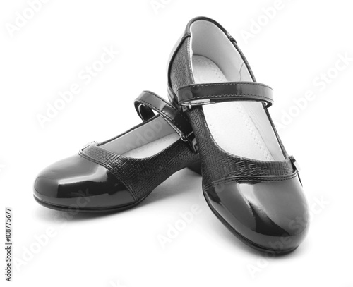 Black shine leather girl shoes isolated on white