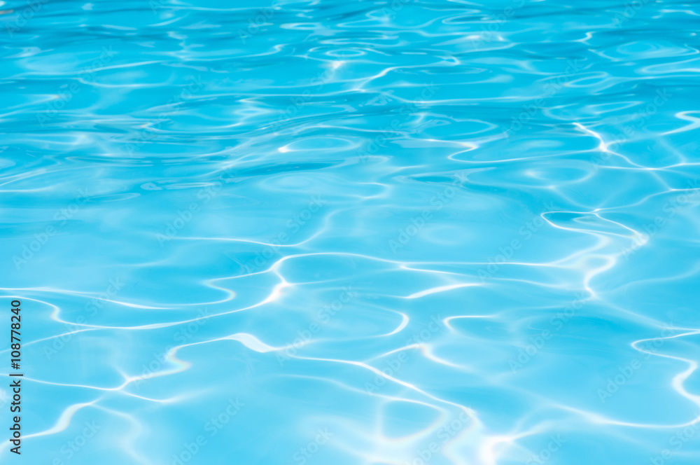 Beautiful Gentle wave in swimming pool with sun reflection