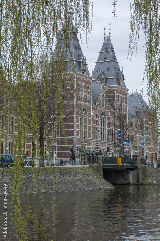 Historical building with museum near the canal in Amsterdam