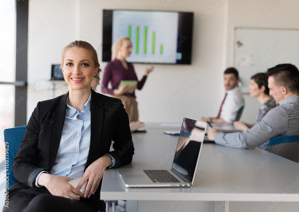 portrait of young business woman at office with team on meeting portrait of young business woman at office with team on meeting