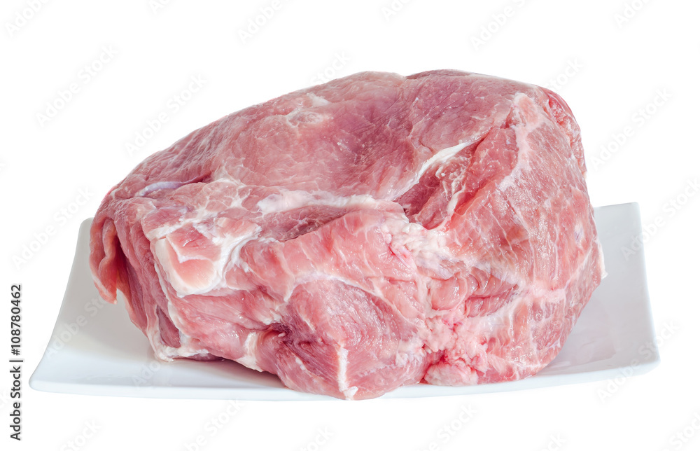 Pork raw meat on a white plate, close up, white background Pork raw meat on a white plate, close up, white background