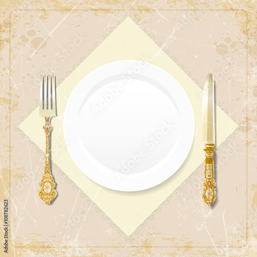 cutlery on grunge background. vintage plate, fork, knife, napkin