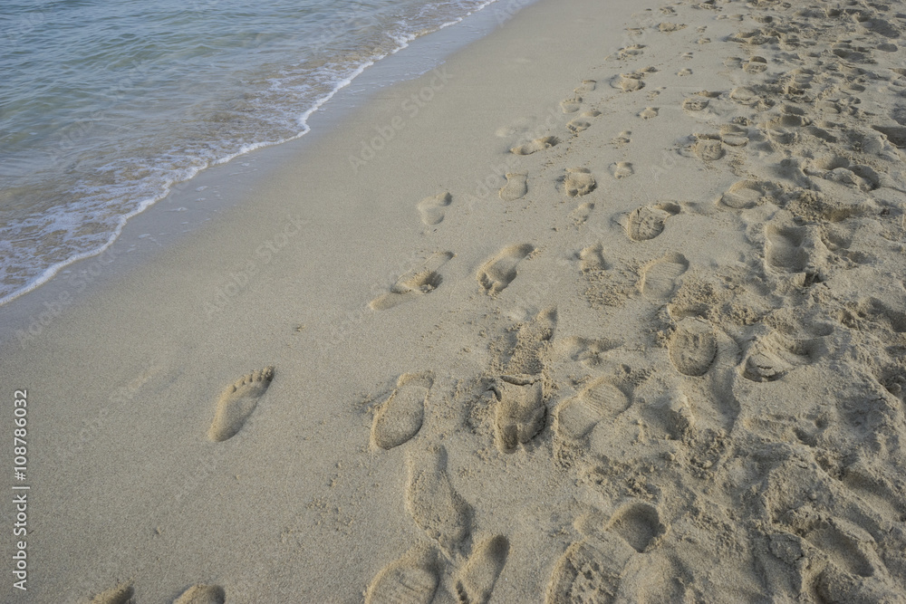 holiday, fine sandy beach with footprints of people on its surfa holiday, fine sandy beach with footprints of people on its surfa