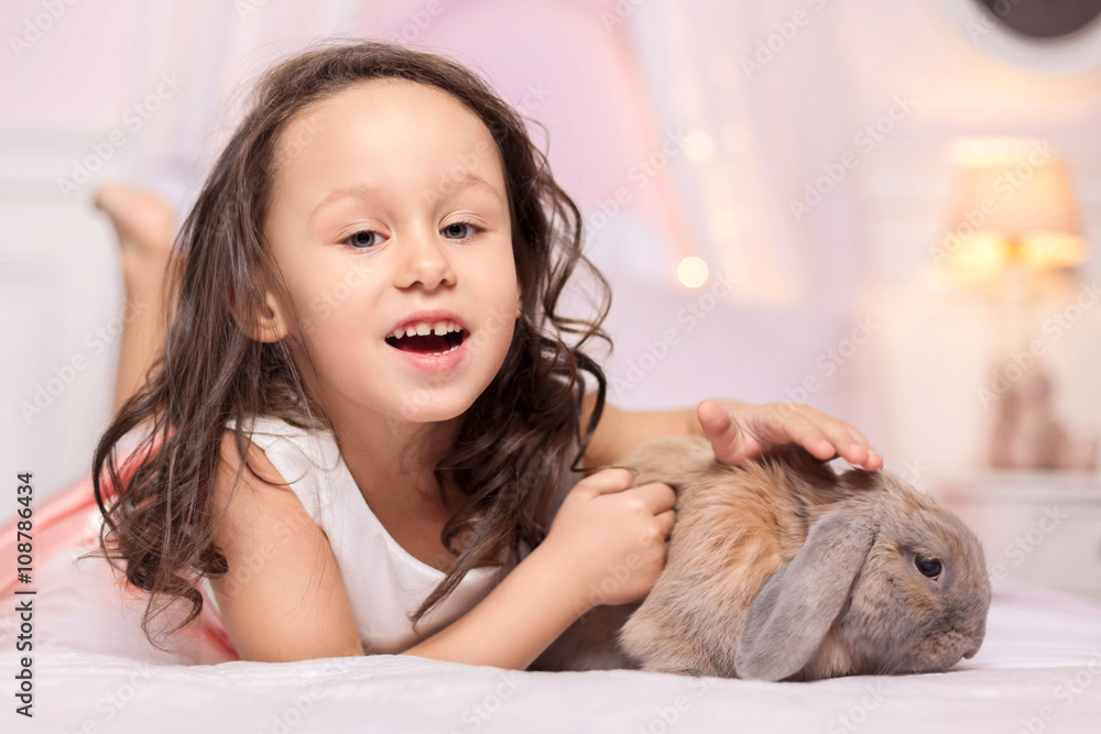 Girl playing with Easter Bunny Girl playing with Easter Bunny