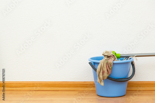 Washing mop with blue bucket photo