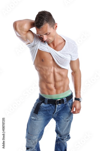 Fotografie Portrait of Powerful Muscular Man Posing on a White Background