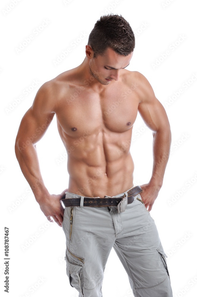 Portrait of Powerful Muscular Man Posing on a White Background Portrait of Powerful Muscular Man Posing on a White Background