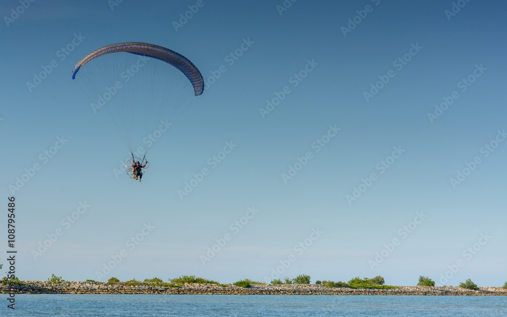 Paramotor on the sky in the evening:Close up,select focus with s Paramotor on the sky in the evening:Close up,select focus with s