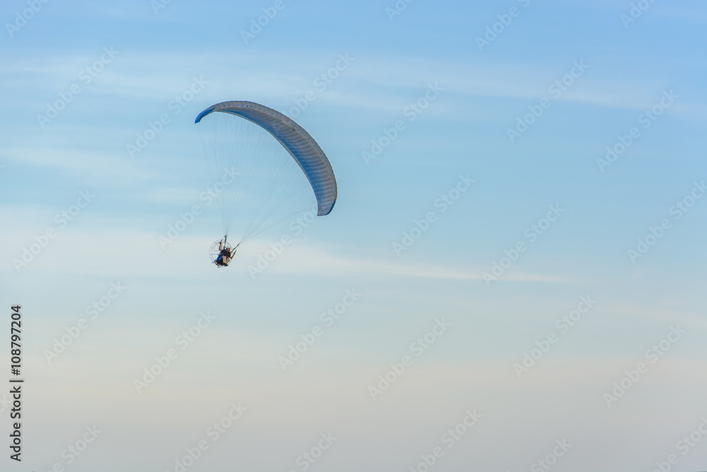Paramotor on the sky in the evening:Close up,select focus with s Paramotor on the sky in the evening:Close up,select focus with s