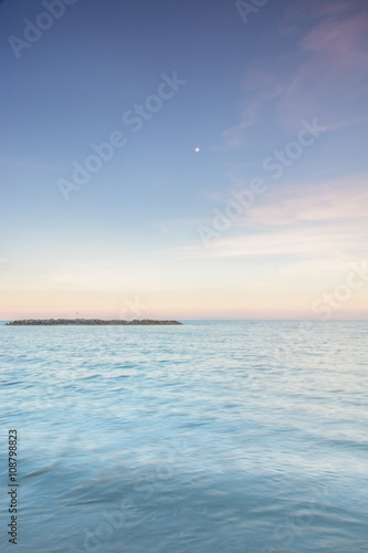 Long exposure dramatic tropical sea and sky sunset Un-focus imag