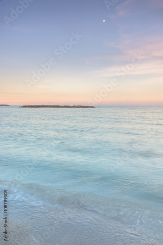 Long exposure dramatic tropical sea and sky sunset Un-focus imag