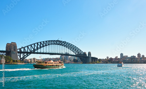 View of Harbour bridge with ferry boat, Sydney