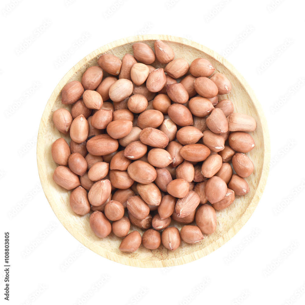Groundnut in wooden bowl isolated on white background Groundnut in wooden bowl isolated on white background