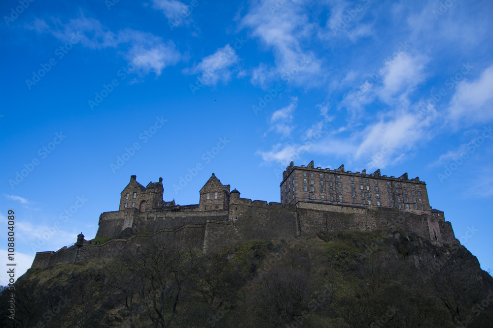 Edinburgh castle on top of castle rockl, in the center of Edinburgh City. The castle has become a symbol of Edinburgh.