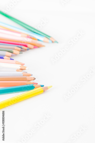 Closeup of Colour pencils on white background, selective focus