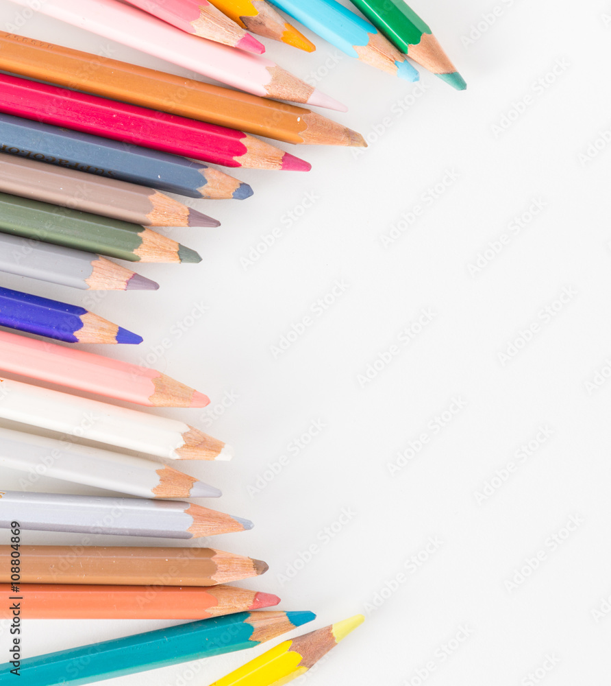 Closeup of Colour pencils on white background, selective focus Closeup of Colour pencils on white background, selective focus