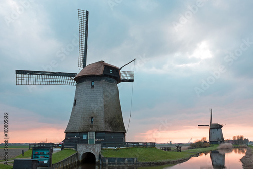 Traditional windmills in a dutch landscape in the Netherlands