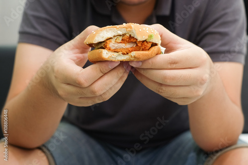 close up man hand gesture showing hamburger fast food concept.
