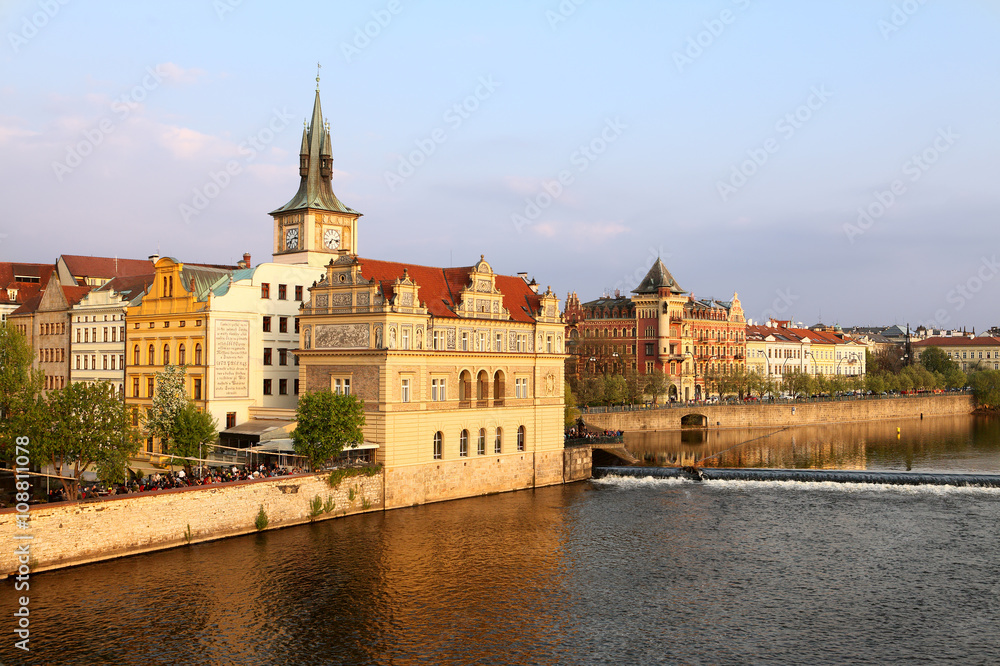 Old Town ancient architecture and Vltava river pier in Prague