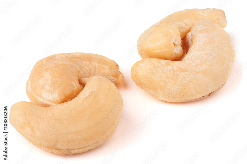 few cashew nuts on a white background close-up few cashew nuts on a white background close-up
