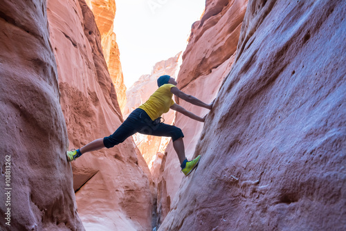 Woman climbing in canyon, Sinai, Egypt