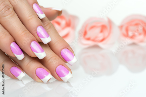 Woman hands with french manicure close up
