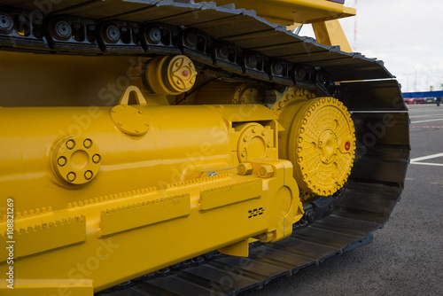 closeup track of  large construction machine.