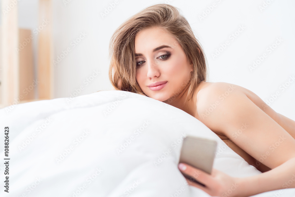 Sexually attractive girl lying in bed Sexually attractive girl lying in bed