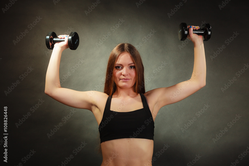 Fit woman exercising with dumbbells. Fit woman exercising with dumbbells.