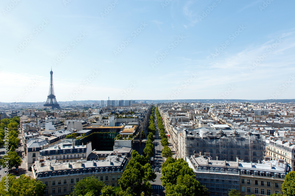 Color DSLR wide angle stock image of the landmark, tourist destination Eiffel Tower, Paris, France, with the skyline of Paris in the foreground and background. Horizontal with copy space for text