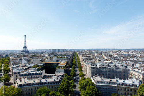Color DSLR wide angle stock image of the landmark, tourist destination Eiffel Tower, Paris, France, with the skyline of Paris in the foreground and background. Horizontal with copy space for text