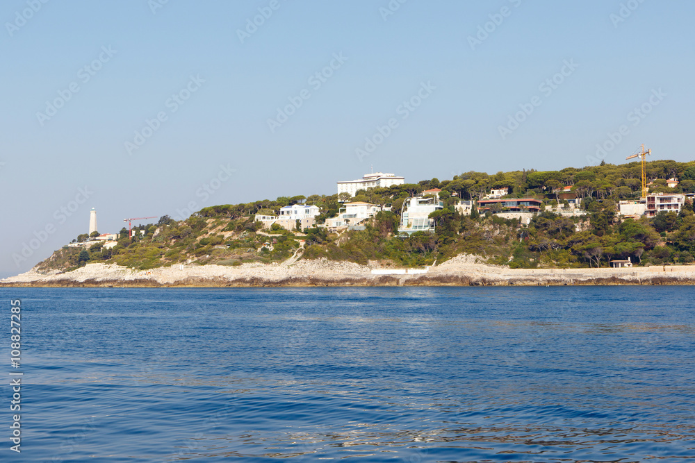 Color DSLR stock image of houses, apartments and condominiums along the Mediterranean coast of the French Riviera near Nice, France. Horizontal with copy space for text
