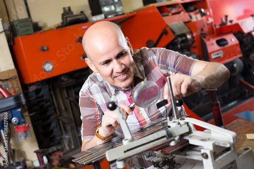 worker making nameboard