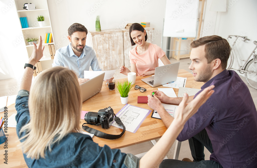 Cheerful creative team is working with joy Cheerful creative team is working with joy