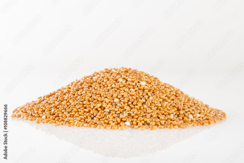 Heap of millet groats on white Heap of millet groats on white