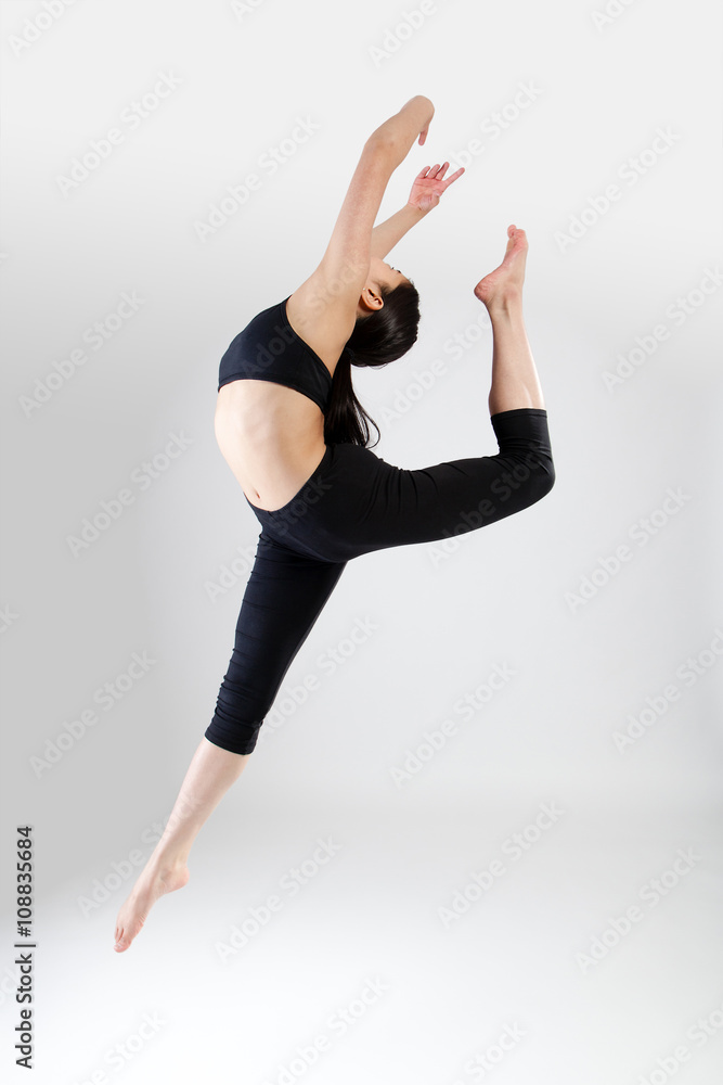 Young Dancer Performing a Ring Jump Young Dancer Performing a Ring Jump