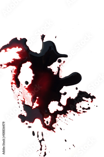 Conceptual image of a sharp knife with blood on it resting on tiles on the floor