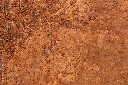 Dry red soil and small rock in Thailand.