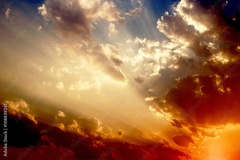 Sunset with clouds, light rays and other atmospheric effects.