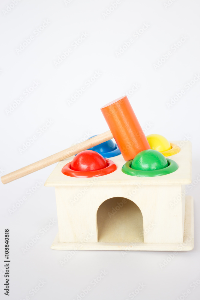 Colorful hammer case wooden toy on white table Colorful hammer case wooden toy on white table