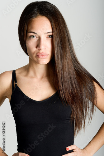 Beautiful young woman without make-up on white background