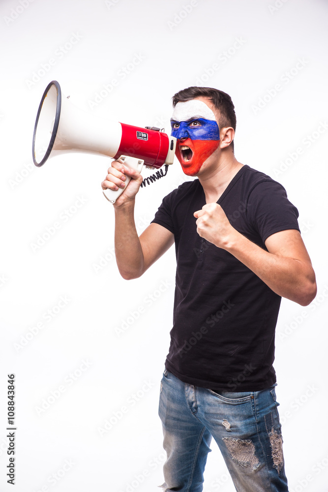 Scream on megaphone Russian football fan in game supporting of Russia national team on white background. European football fans concept.